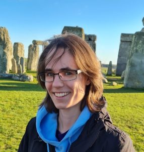 Ara standing in front of Stone Henge